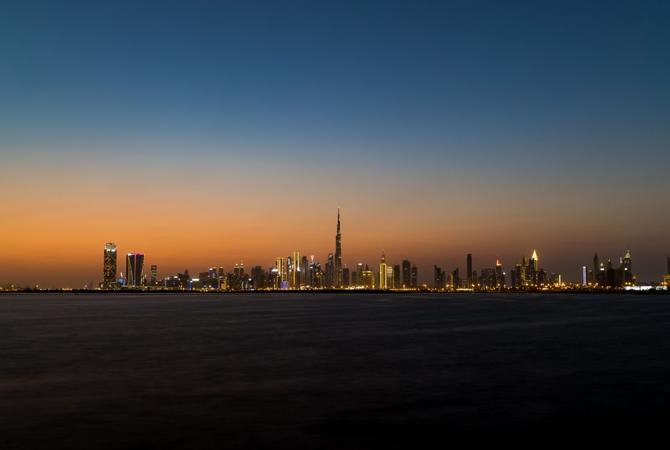 Burj Khalifa towering over Dubai at sunset, UAE