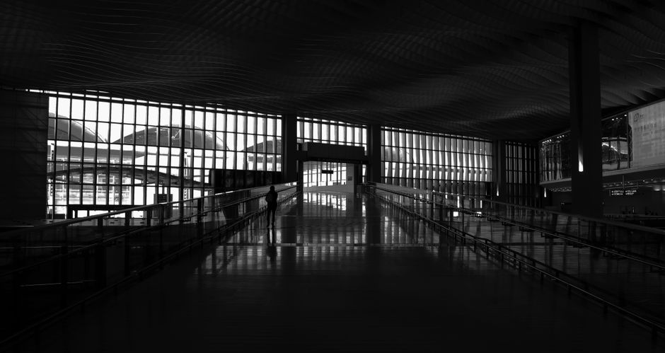 Modern terminal at Dubai International Airport, UAE, bustling with travelers