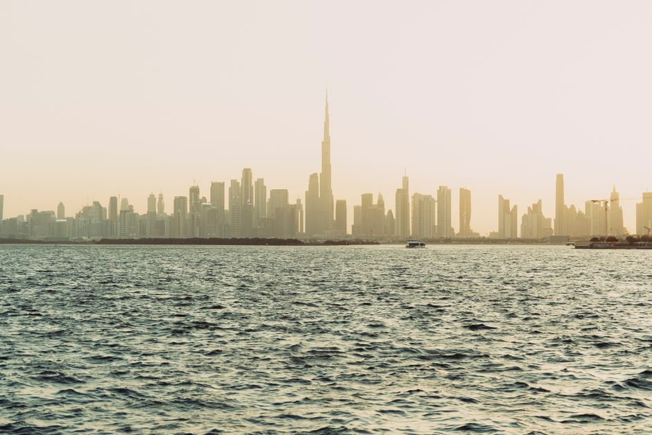 Stunning sunset view of Dubai skyline with modern skyscrapers and Burj Khalifa in UAE