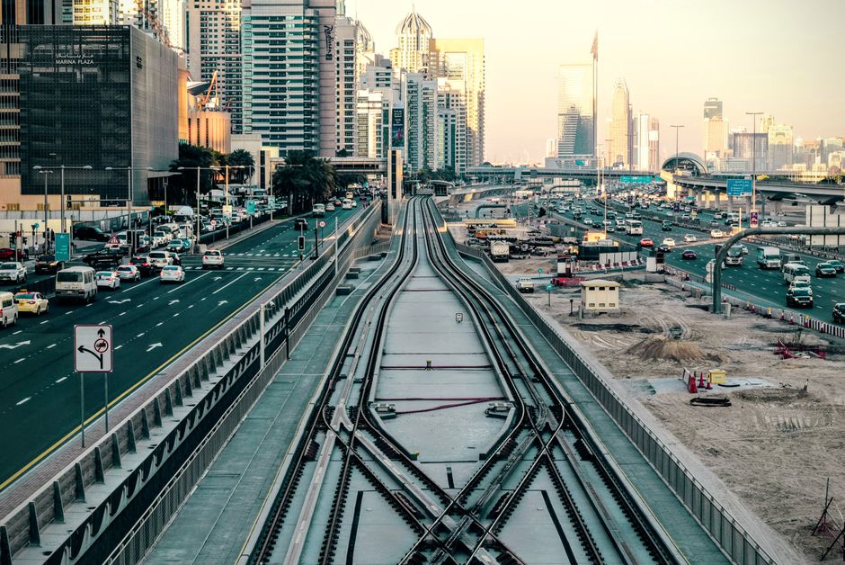 Modern Dubai Metro train arriving at a station platform in the UAE