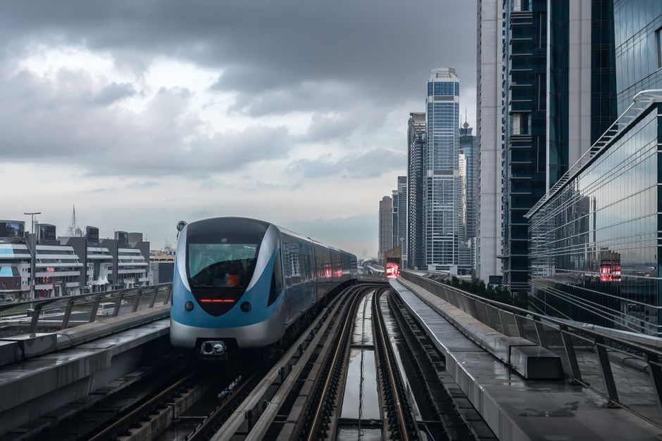 Modern Dubai Metro train arriving at a station platform in UAE