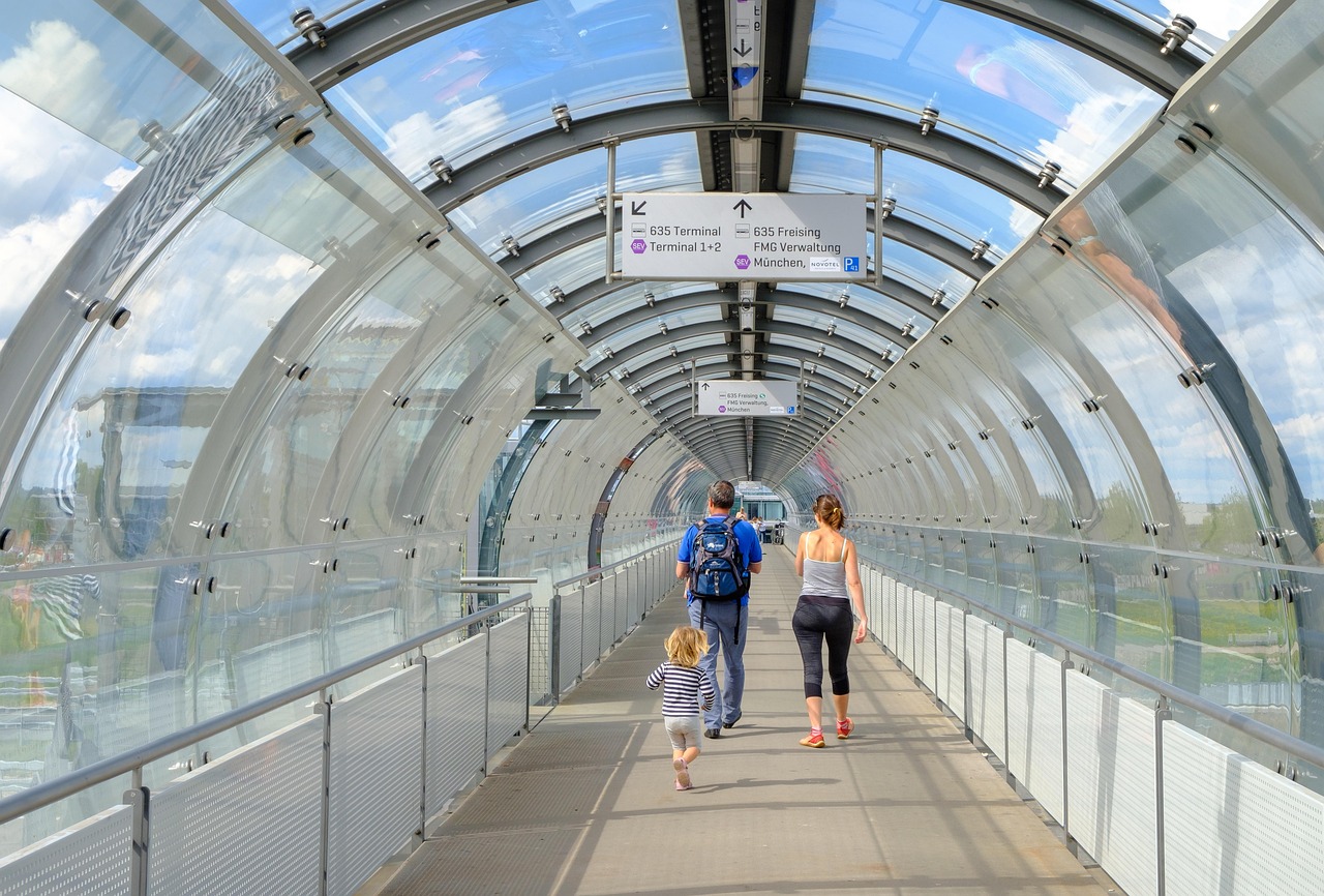 Modern, bustling airport terminal in the USA with travelers and airplanes