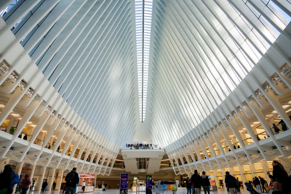 Bustling shopping mall interior in the United States with diverse shoppers