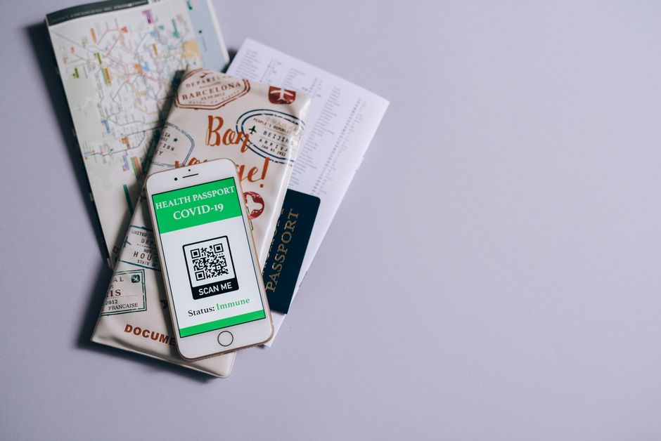 Travel insurance documents, passport, and map for a trip to the USA