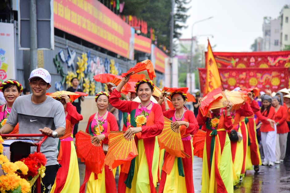 A vibrant traditional Vietnamese festival with people in colorful attire, showcasing the rich culture of Vietnam