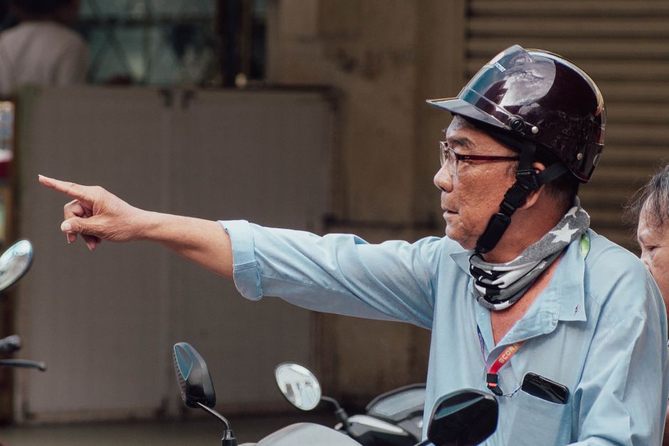 Tourist navigating Ho Chi Minh City, Vietnam with a smartphone map