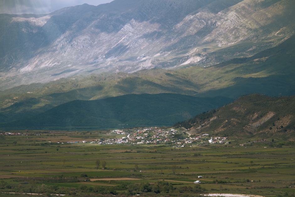 Stunning Albanian landscape with mountains and clear water, inviting travel