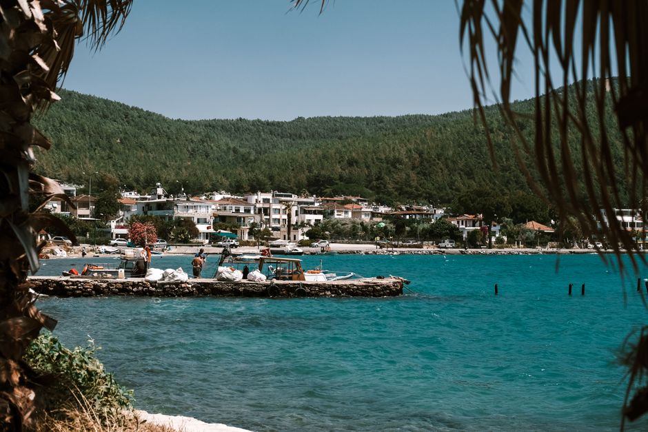 Sunny beach on the Albanian Riviera in Ksamil with clear turquoise water and blue sky