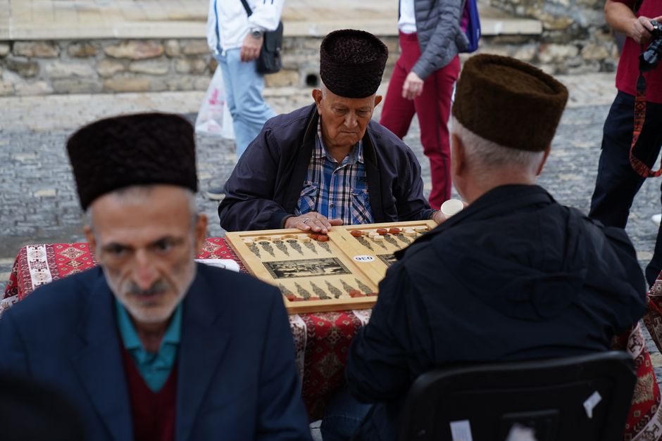 Bustling Vernissage Market in Yerevan, Armenia, with vendors selling crafts and souvenirs