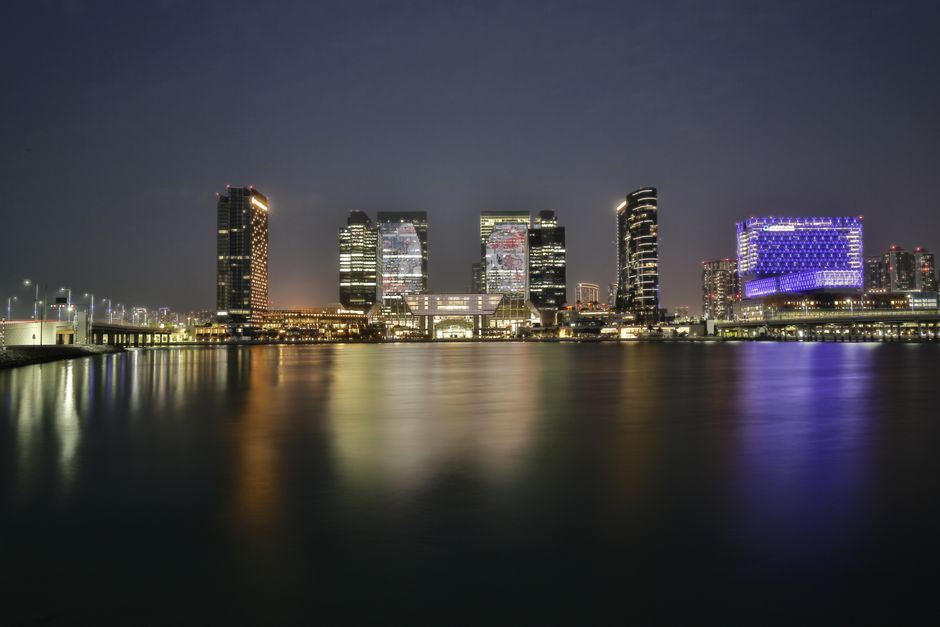 Stunning view of a luxury hotel in Bahrain Bay at sunset