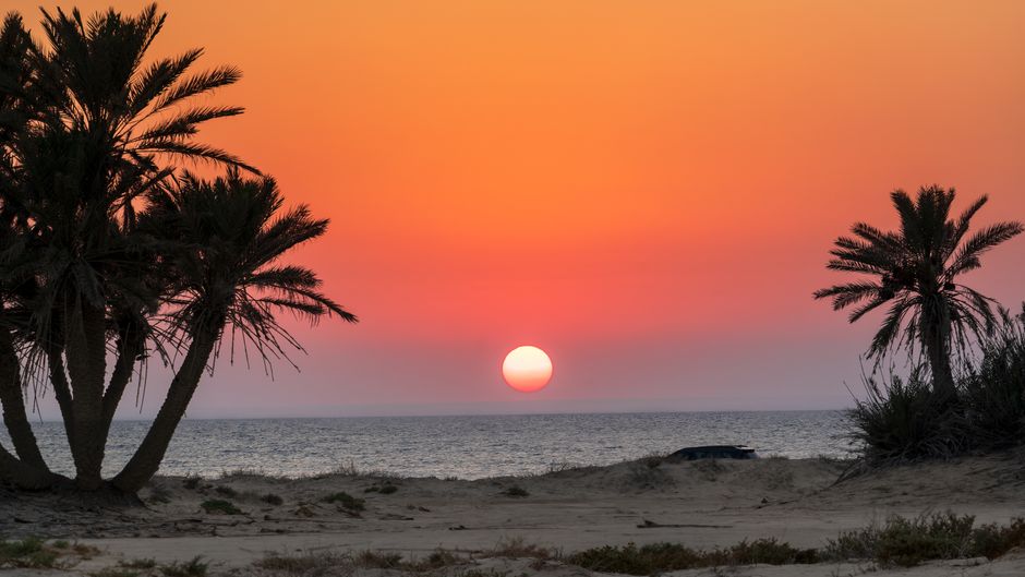 Sunset view over Qal'at al-Bahrain, a UNESCO World Heritage site in Bahrain