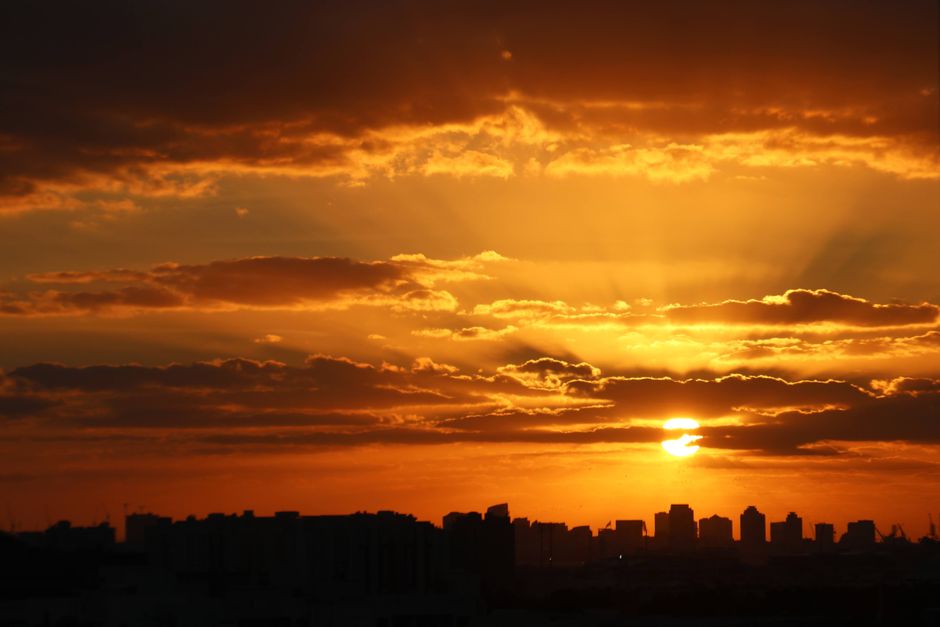 Manama skyline at sunset, showcasing modern architecture and vibrant city life in Bahrain