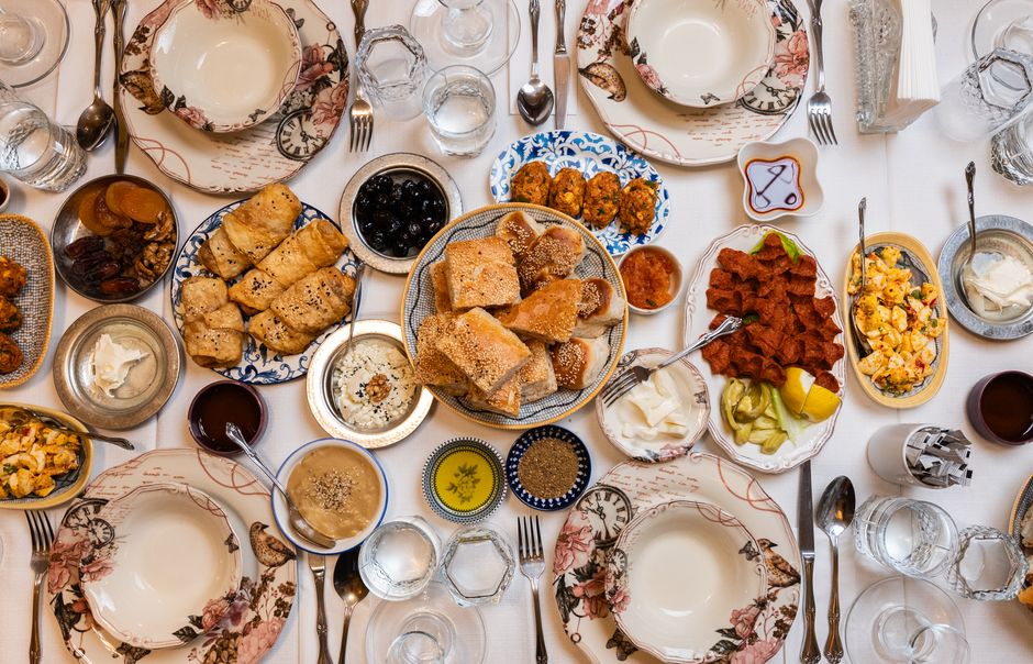 A vibrant spread of traditional Bahraini dishes like Machboos and Harees on a table in Manama.
