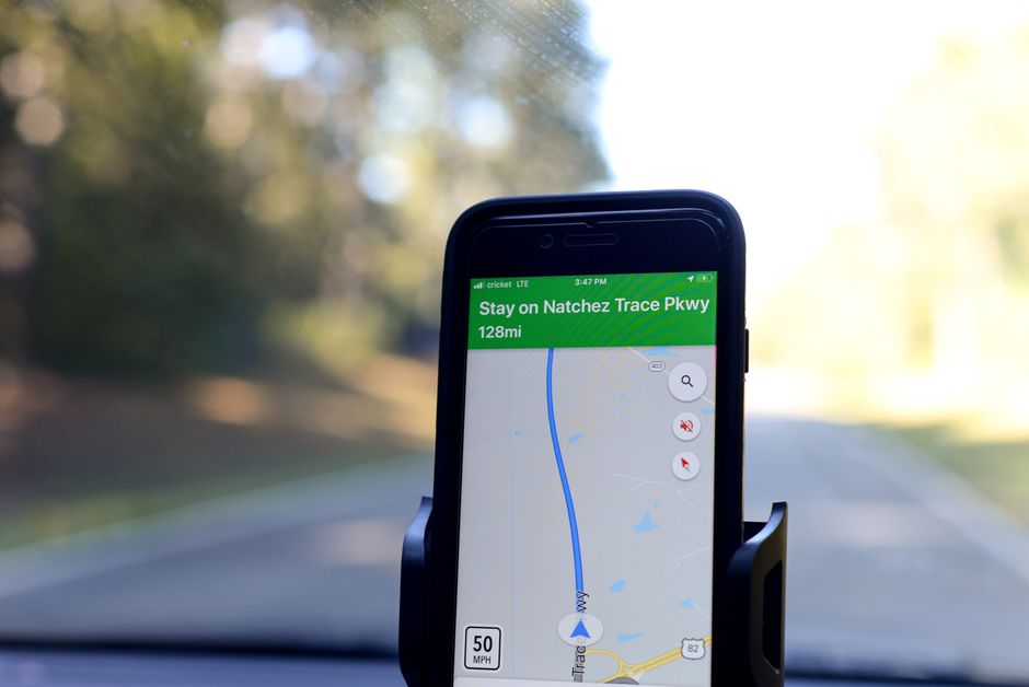 Traveler using a navigation app on a phone in Bahrain