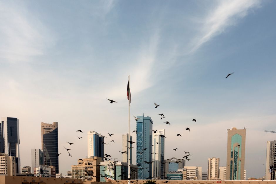 Panoramic view of Manama, Bahrain's capital city, with modern skyscrapers and traditional architecture