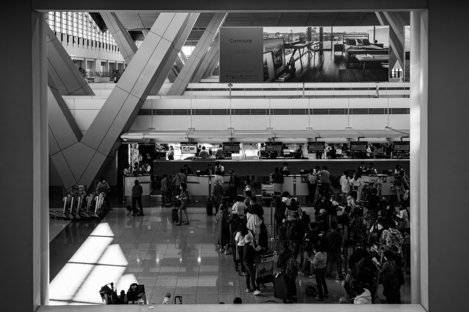 Traveler purchasing a SIM card at a kiosk in Bahrain International Airport