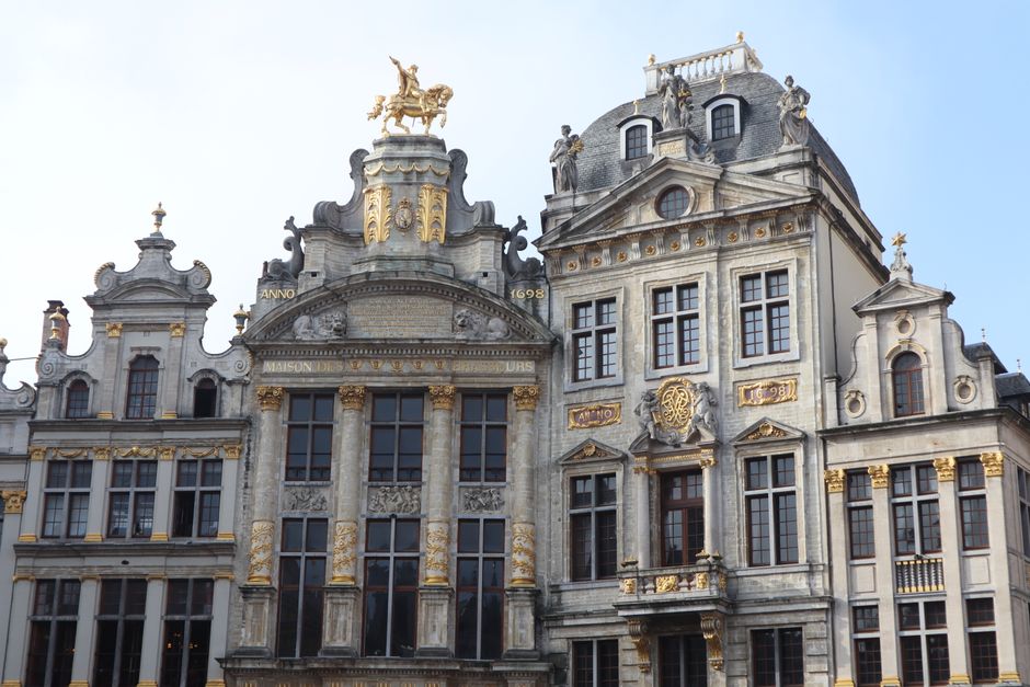 Vibrant Grand Place square in Brussels, Belgium, bustling with tourists and historic architecture