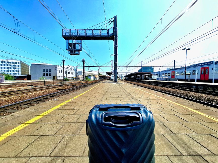 Modern train arriving at a station in Belgium, ready for a day trip adventure