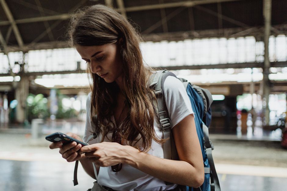 Traveler checking phone with a Belgian SIM card in Brussels