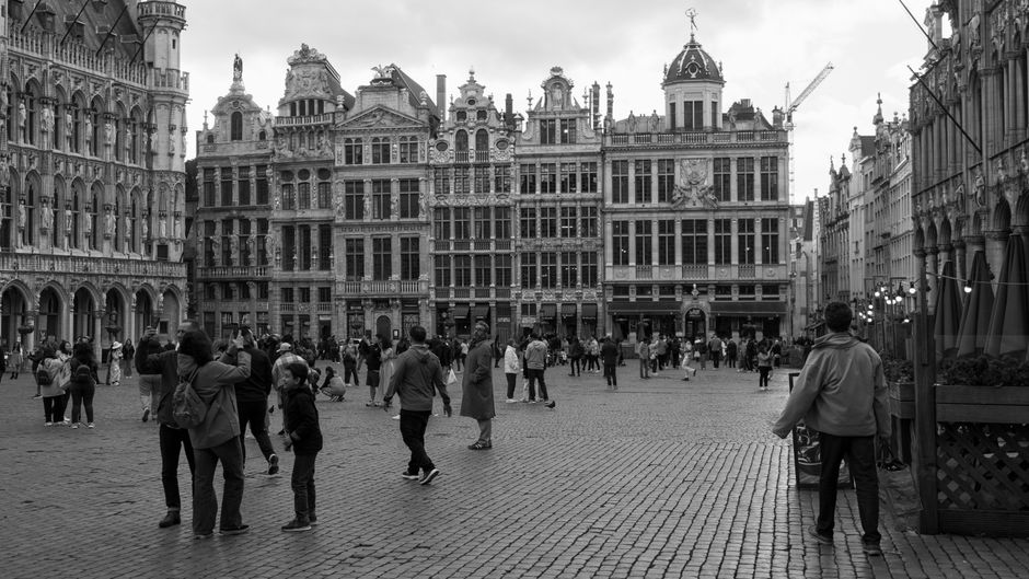 Tourists gathered at Grand Place in Brussels, Belgium, ready for a walking tour