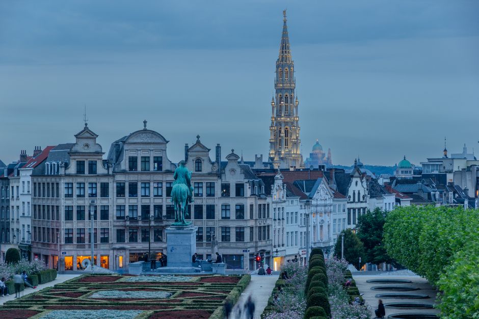 Traveler enjoying the historic Grand Place in Brussels, Belgium, symbolizing worry-free travel