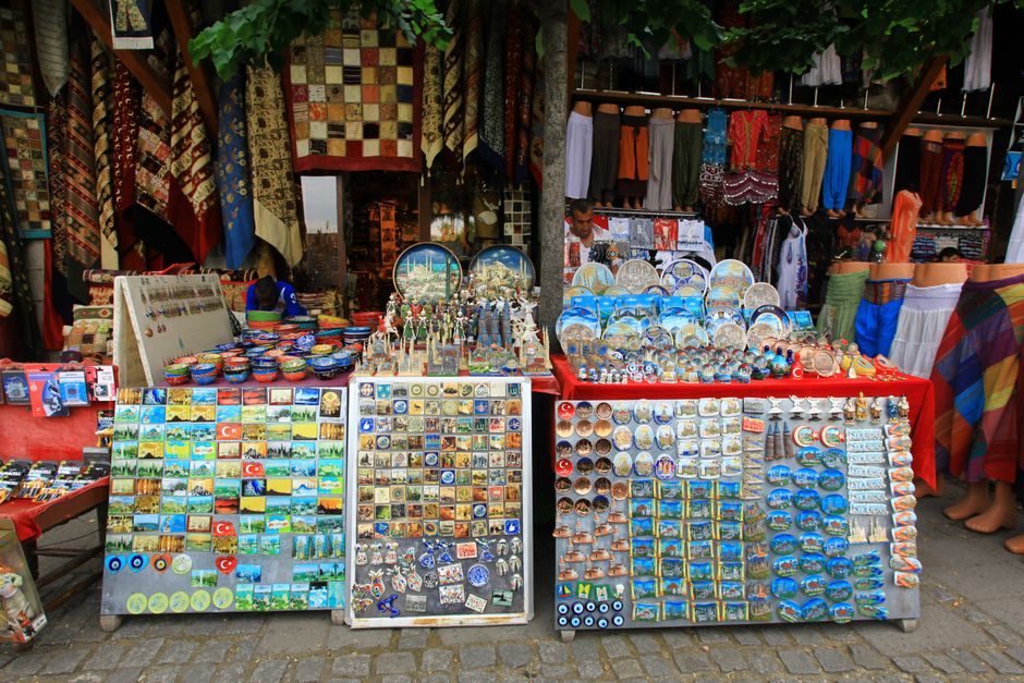 A vibrant market stall in Baščaršija, Sarajevo, Bosnia and Herzegovina, showcasing traditional copperware and souvenirs.