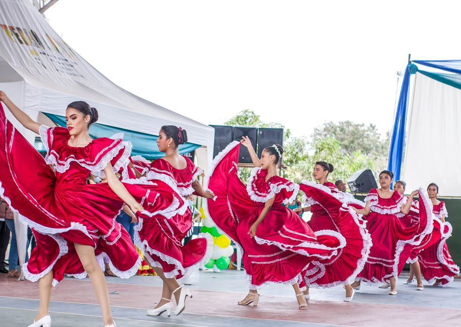 Vibrant Merengue dancers celebrating Dominican Republic culture at a festival