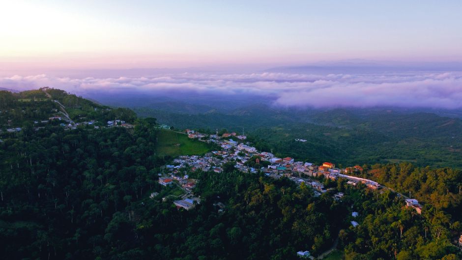 Scenic view of a well-maintained highway winding through the lush landscape of the Dominican Republic