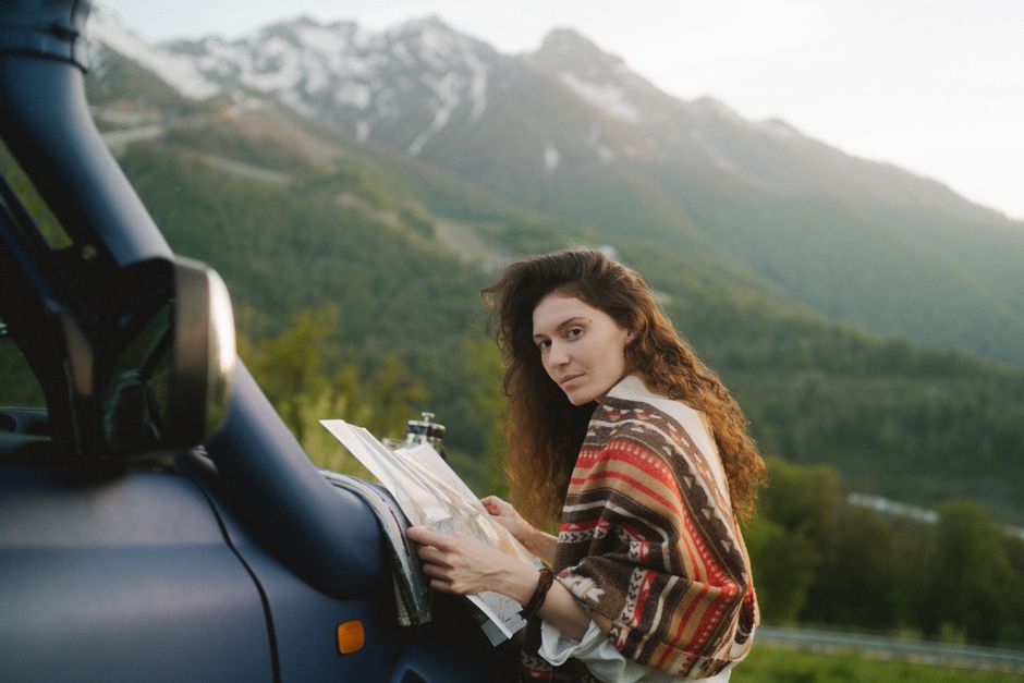 Traveler enjoying a stunning mountain landscape in Georgia, symbolizing safe and worry-free exploration with travel insurance