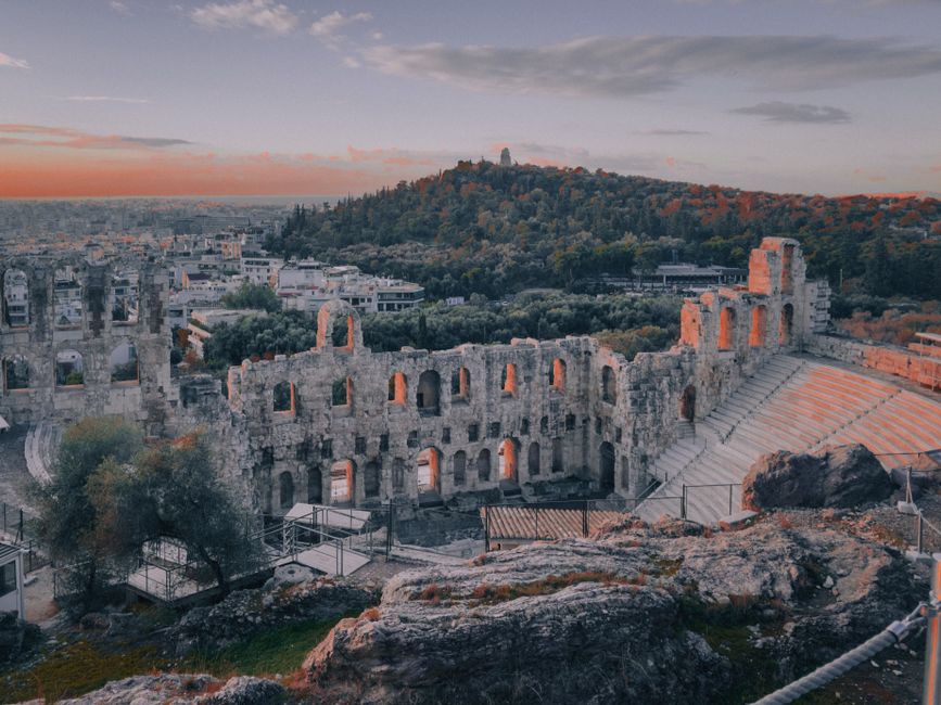 Sunset view of the Acropolis in Athens, Greece, with ancient temples glowing golden