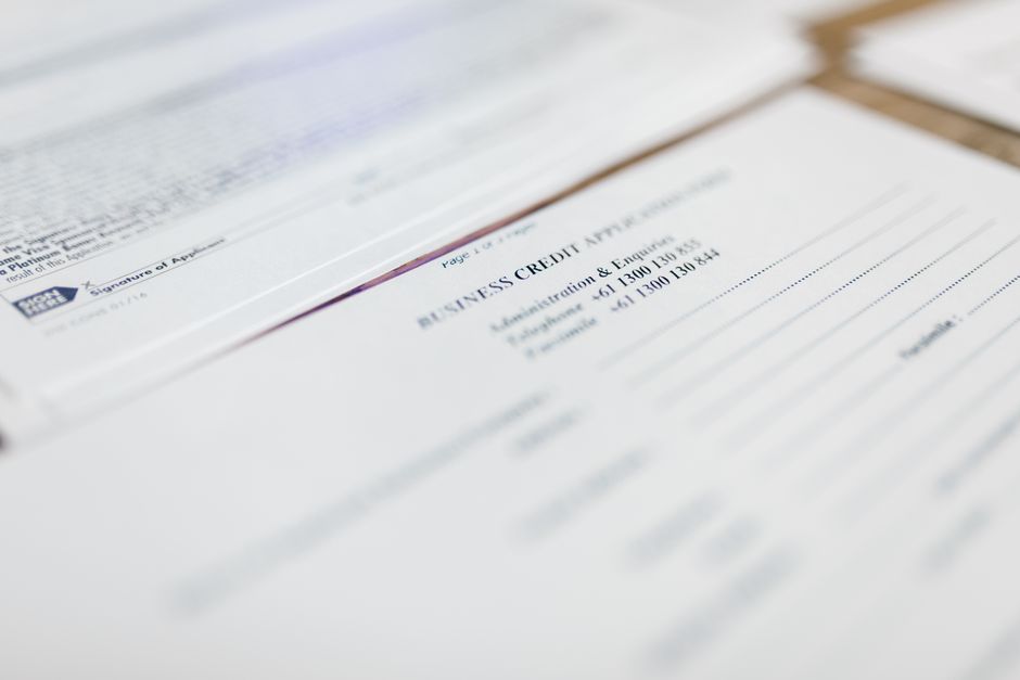 Travel insurance policy documents with a map of Greece in the background, symbolizing peace of mind for travelers.