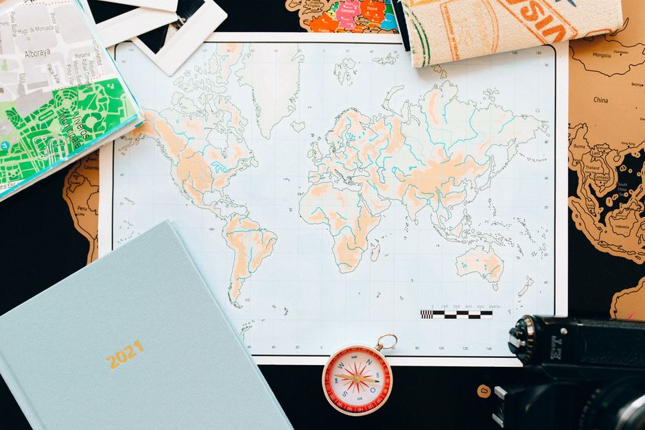 Traveler planning an itinerary with a map of Indonesia and local currency