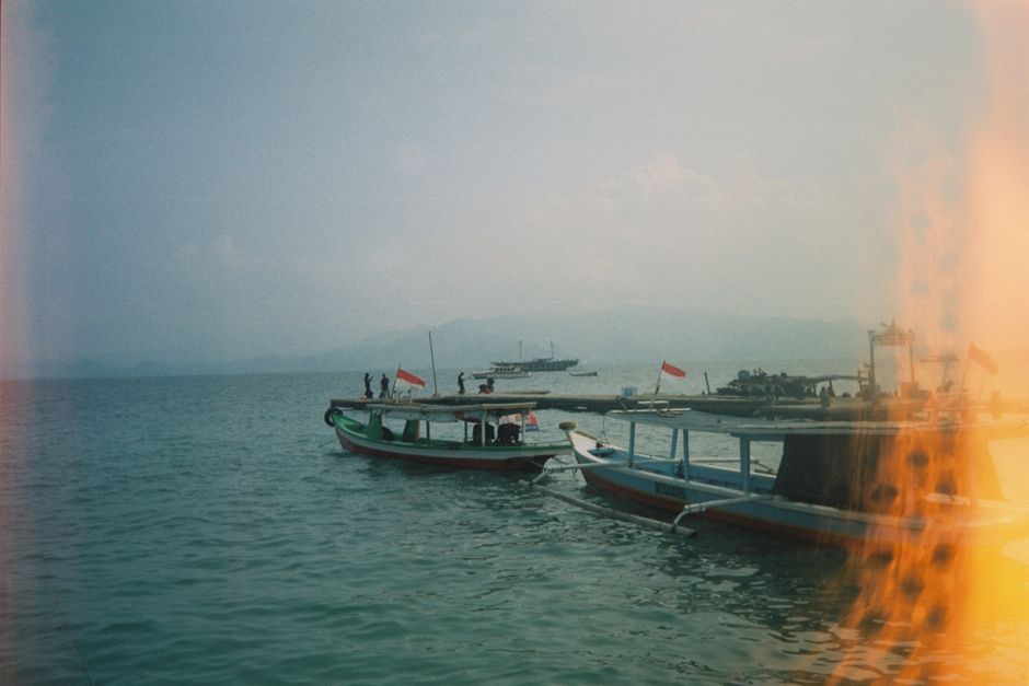 Traditional wooden boat docked at Gili Trawangan beach in Indonesia