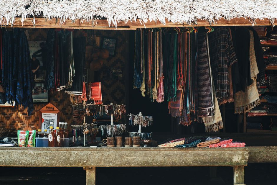 Vibrant traditional market scene in Indonesia with various local products and crafts
