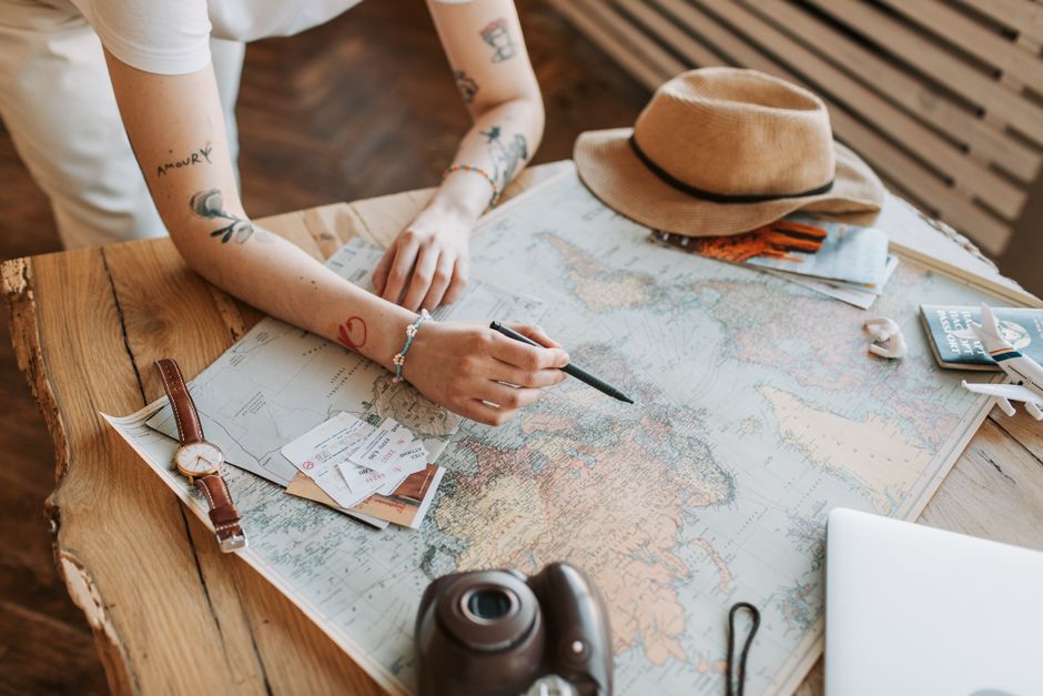 Traveler planning trip with map on a beautiful Indonesian beach