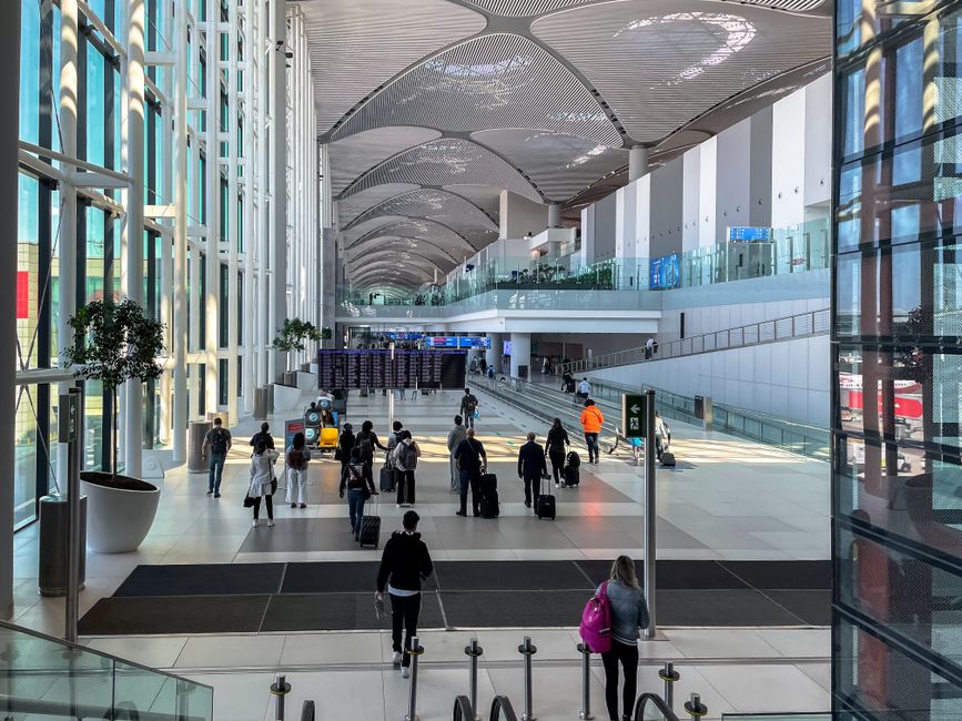 Modern departure terminal at Ben Gurion Airport, Israel, with passengers waiting