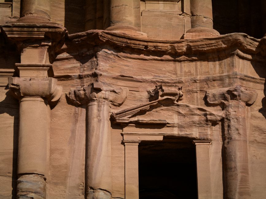 The iconic Treasury (Al-Khazneh) in Petra, Jordan, carved into sandstone cliffs.