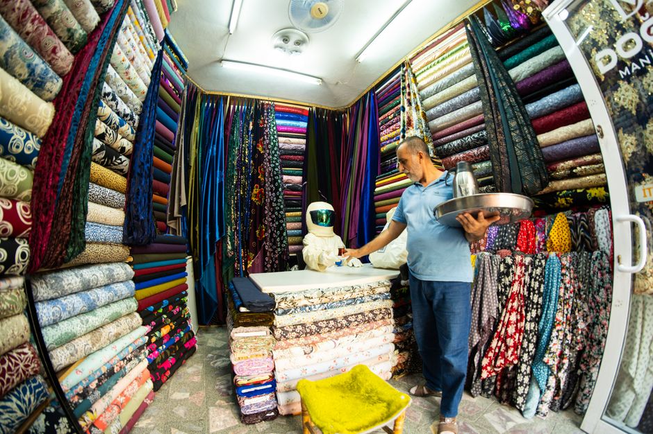 A bustling traditional souk in Amman, Jordan, with colorful textiles and local crafts