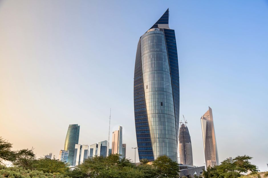 Stunning sunset over Kuwait City skyline with modern skyscrapers