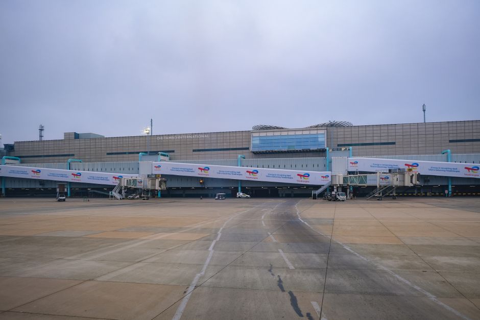 Modern terminal at Kuwait International Airport (KWI) with planes on the tarmac