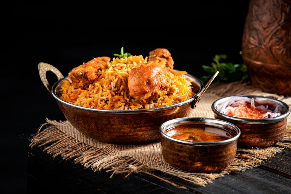 A vibrant plate of Kuwaiti Machboos with rice, meat, and spices, a traditional dish from Kuwait
