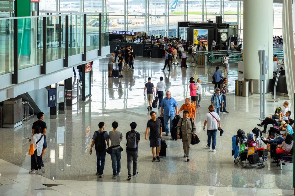 Traveler purchasing a prepaid SIM card at Kuala Lumpur International Airport, Malaysia