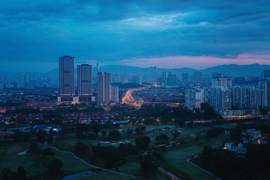 Kuala Lumpur skyline at sunset, symbolizing safe travels in Malaysia