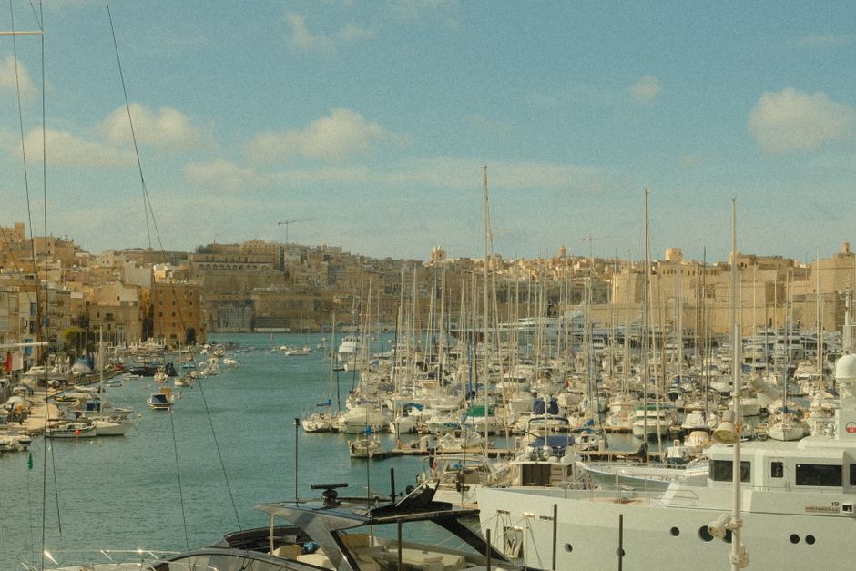 Panoramic view of Valletta, Malta, a historic city with ancient fortifications and a bustling harbor.