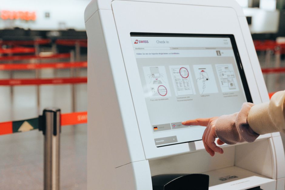 Traveler purchasing a tourist SIM card at Malta International Airport