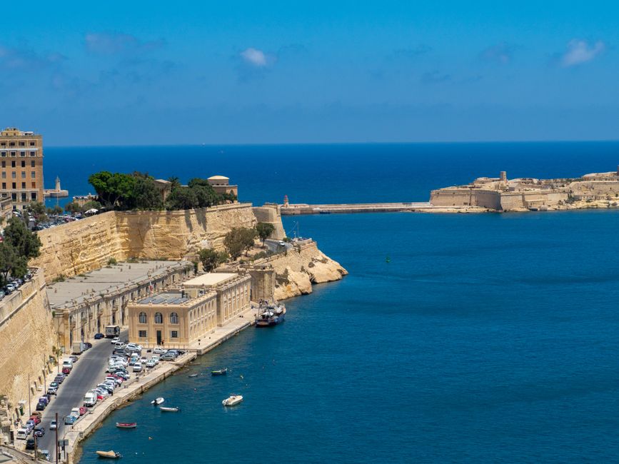 Sunny coastline of Malta with clear blue Mediterranean sea