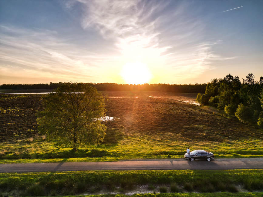 A car driving on a scenic road through the Dutch countryside in the Netherlands
