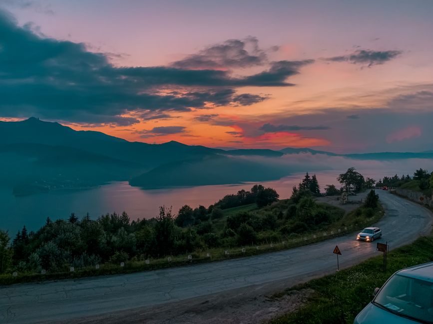 A car driving on a scenic road through the mountains of North Macedonia
