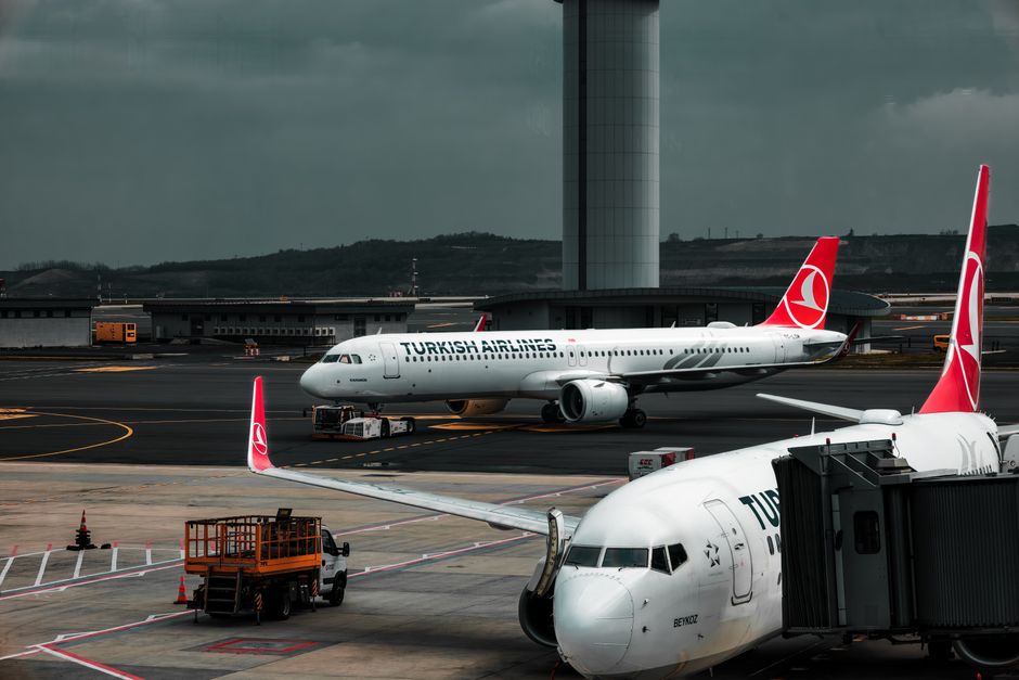 Modern departure terminal at Skopje International Airport, North Macedonia, with passengers waiting