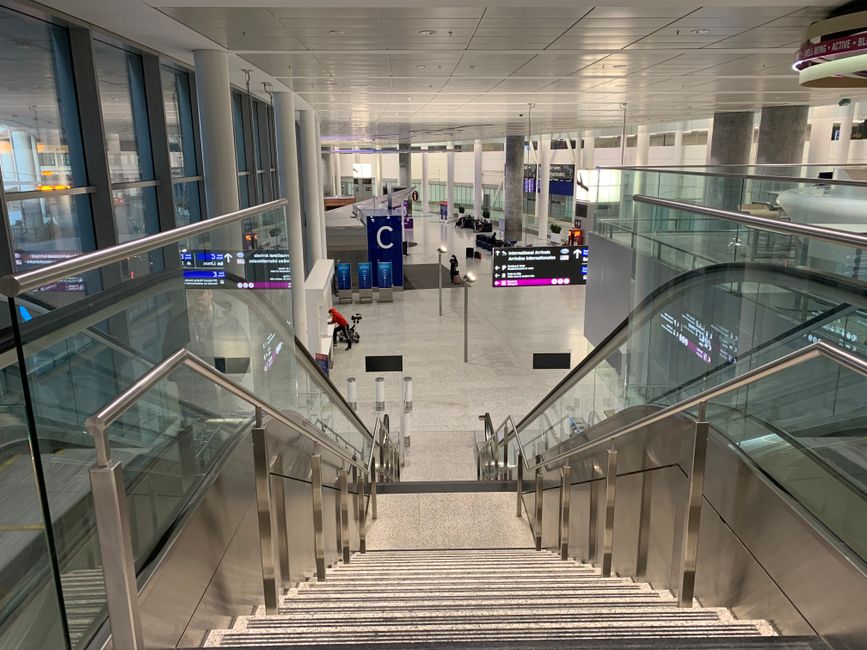 Modern interior of Oslo Gardermoen Airport (OSL) in Norway with travelers